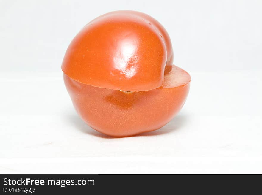 The tomato cut in the middle on two halves