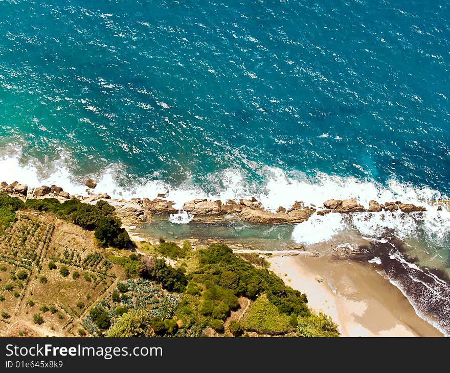 Waves splashing at the shore, aerial view. Waves splashing at the shore, aerial view