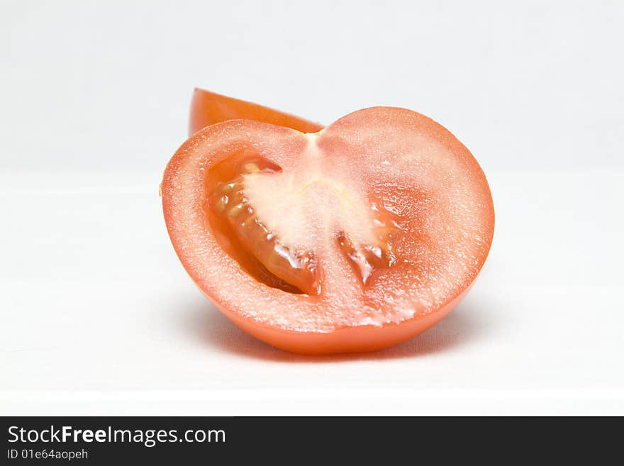 The tomato cut in the middle on two halves