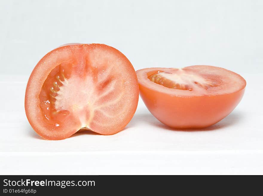 The tomato cut in the middle on two halves