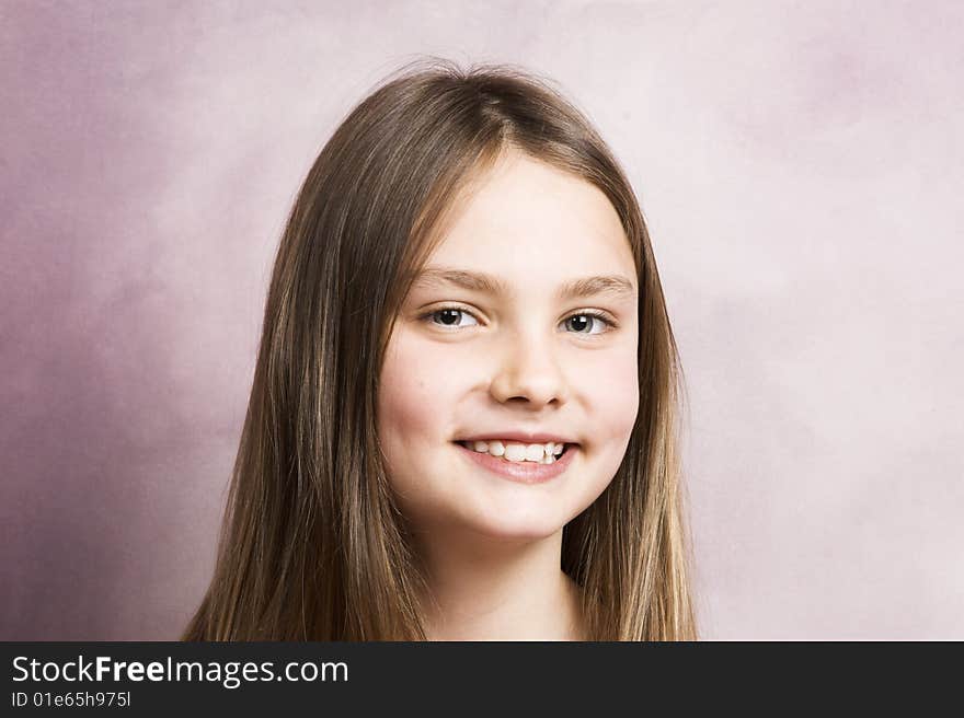 Beautiful young brunette against a pink background. Beautiful young brunette against a pink background