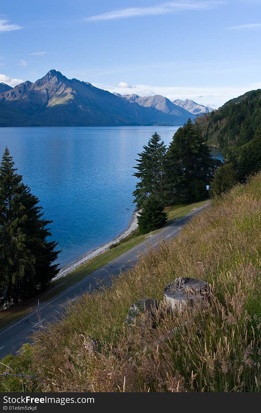 Road beside the lake and mountains