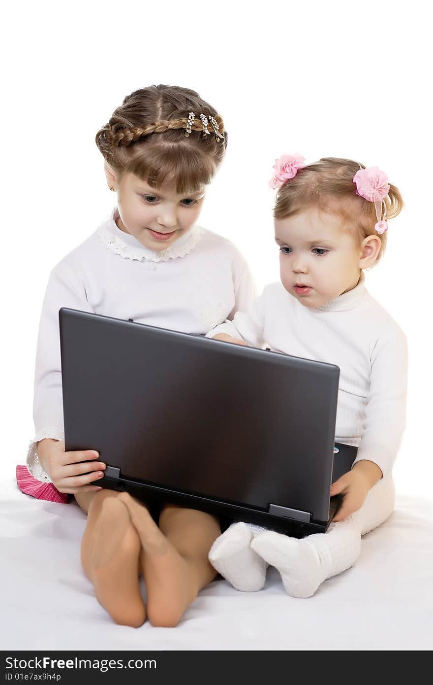 Stock photo: an image of two nice girls with laptop. Stock photo: an image of two nice girls with laptop