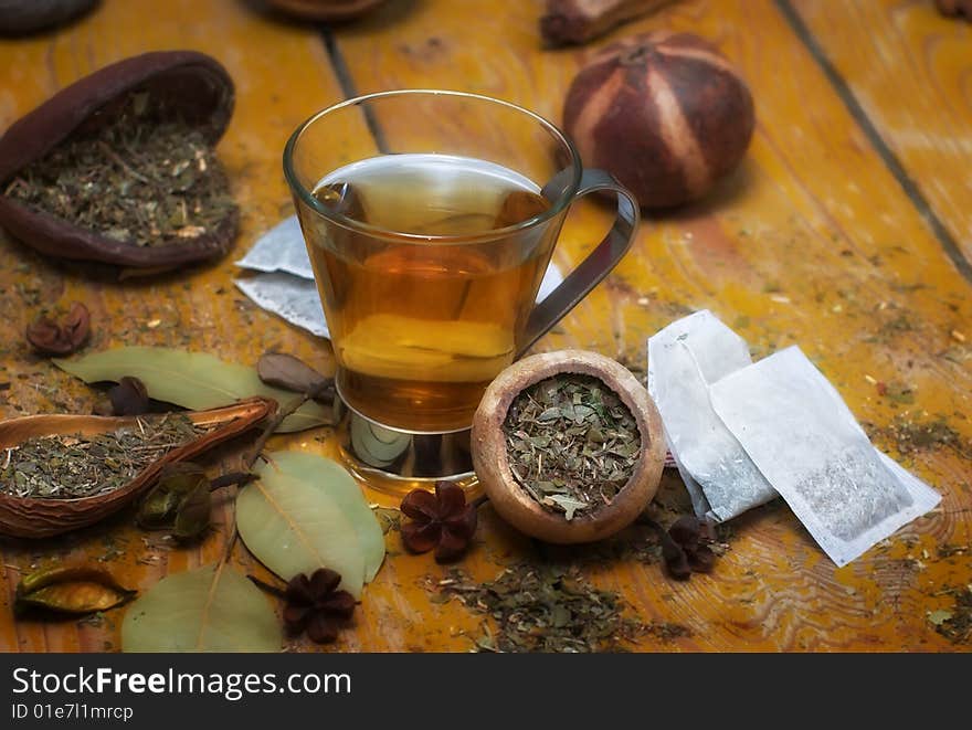 Cup of peppermint tea with diverse herbs