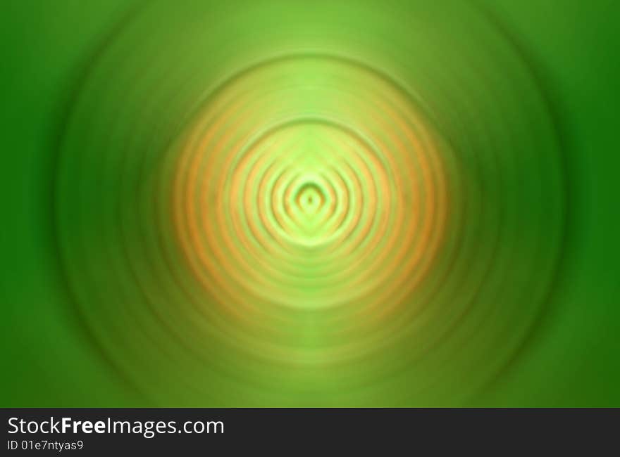 Green circle abstraction with orange and yellow in the middle