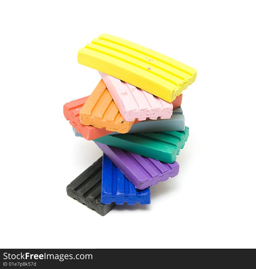 Colorful plasticine bricks on white