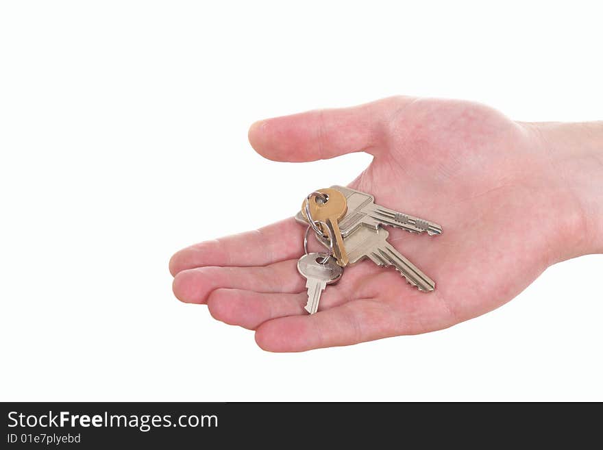 A hand is giving someone a bunch of keys. Isolated over white. A hand is giving someone a bunch of keys. Isolated over white.