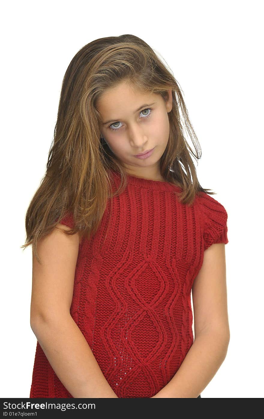 Beautiful young girl posing against a white background. Beautiful young girl posing against a white background