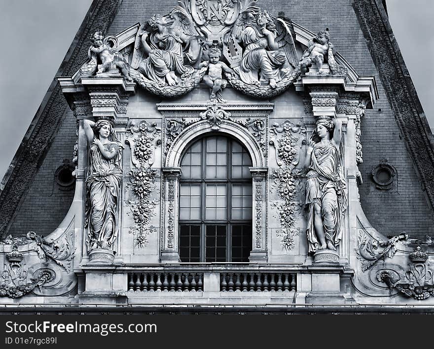 Sculptures on the facade of the building in Paris, France