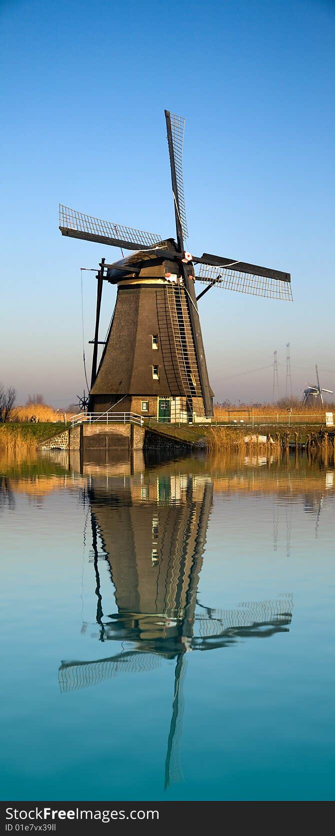 Dutch windmill reflecting on water