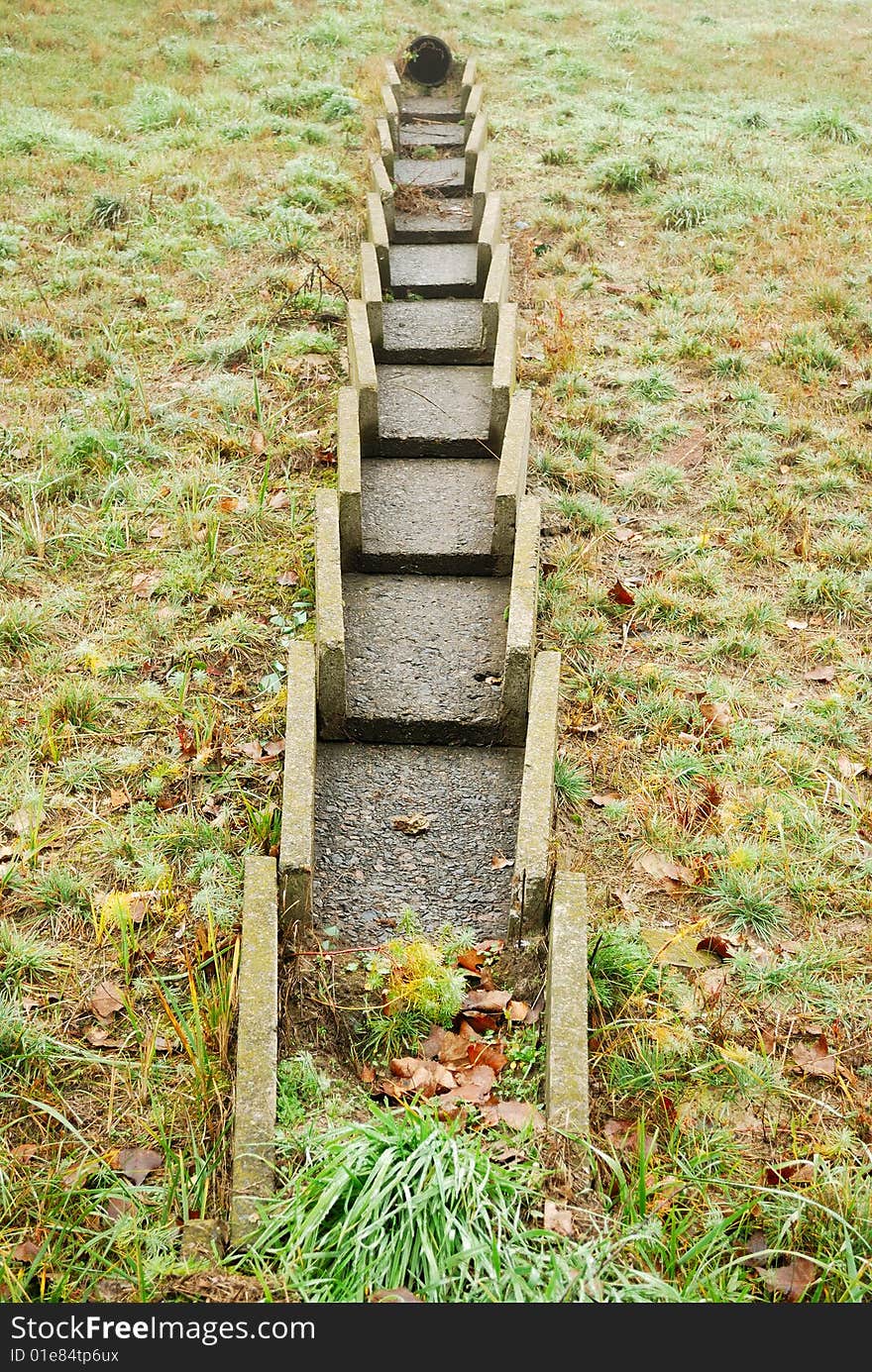 Concrete constructions are in weed, autumn landscape