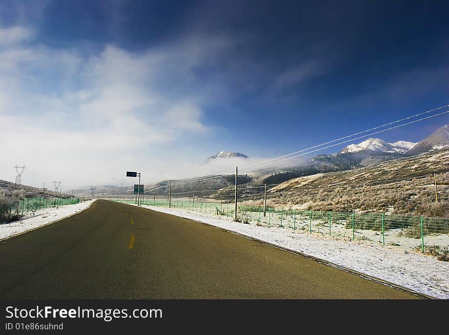 The highway of high mountain imitates a Buddha to lead to heaven. The highway of high mountain imitates a Buddha to lead to heaven