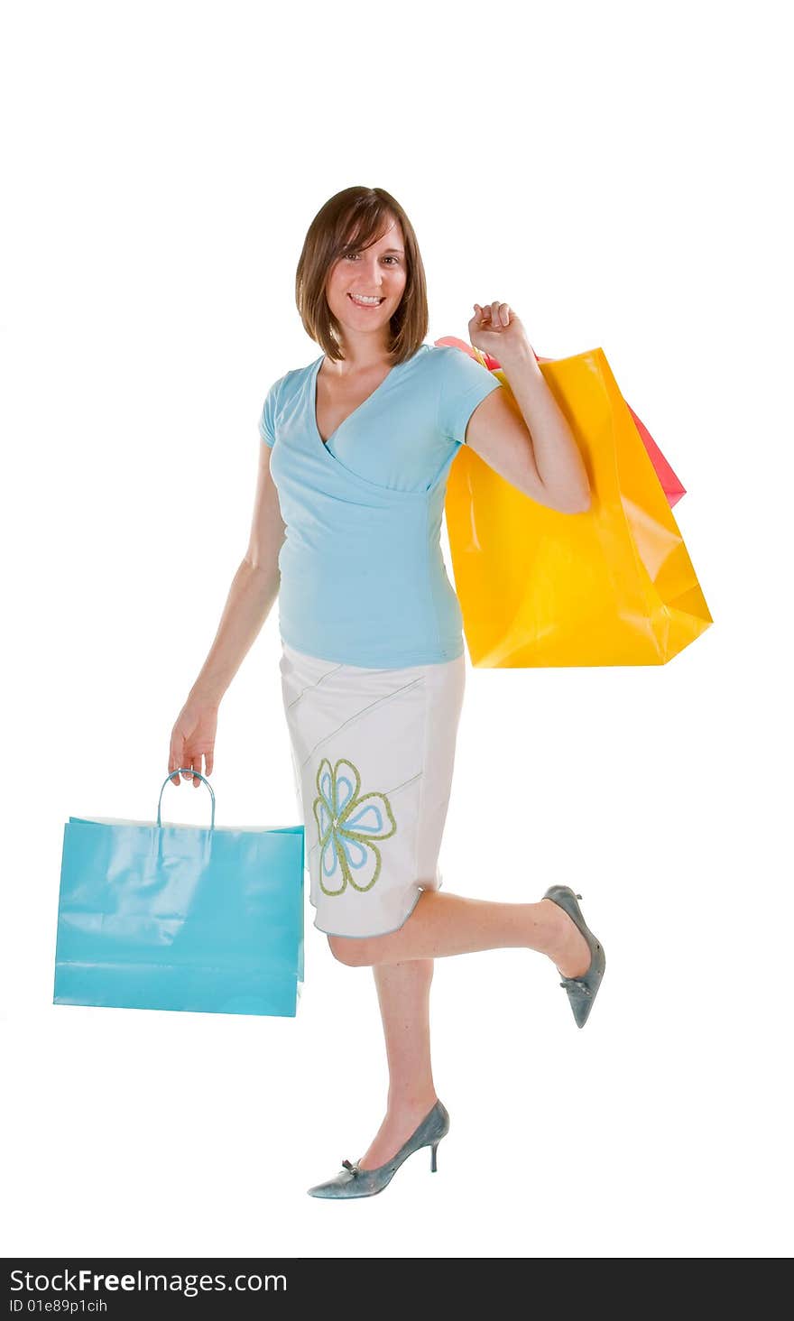 Attractive woman all dressed up and carrying a handful of shopping bags. Attractive woman all dressed up and carrying a handful of shopping bags