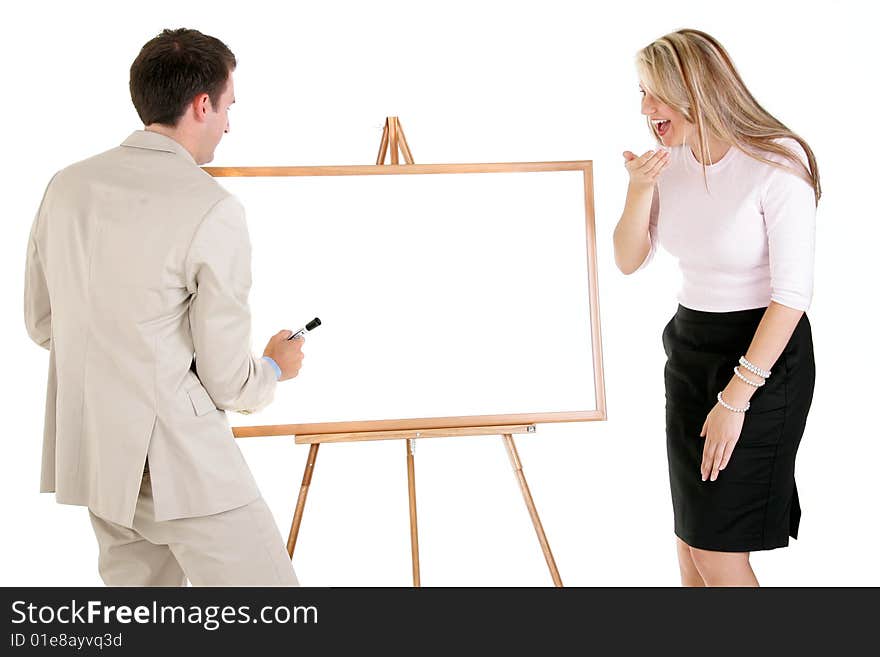 Two business people standing at a whiteboard