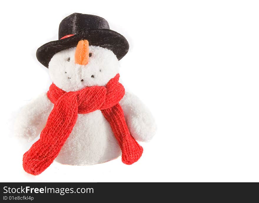 Stuffed snowman with a red scarf and black hat