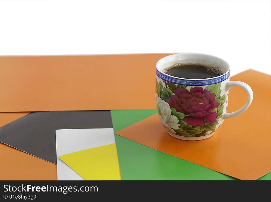 Cup with the coffee against the combined background. Cup with the coffee against the combined background