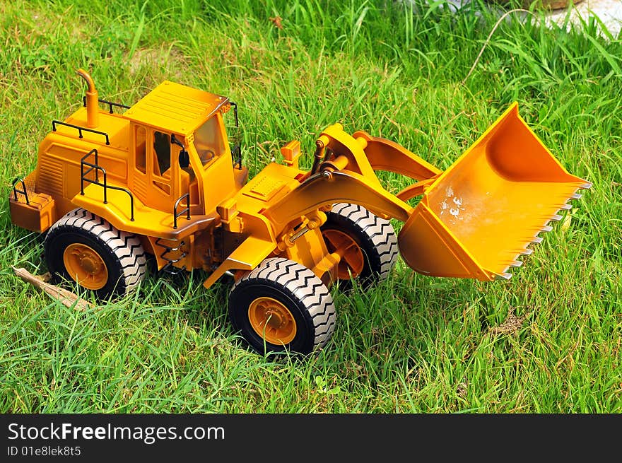 Earth mover model on green grass. Earth mover model on green grass.