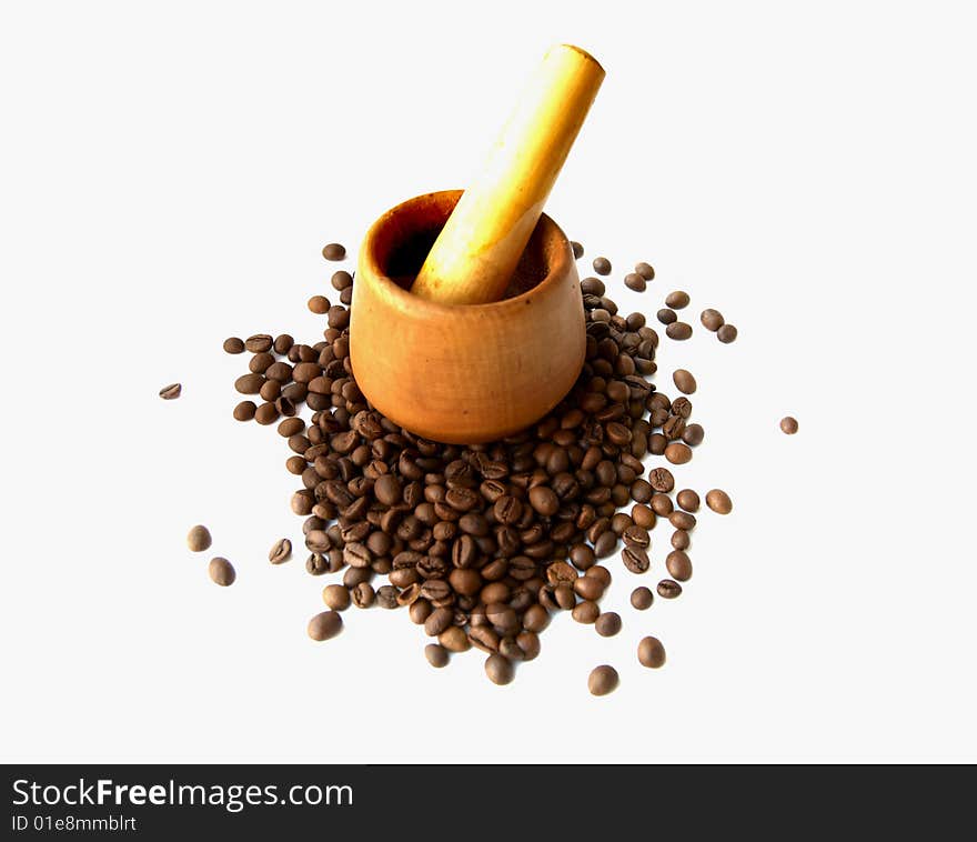 Mortar for crushing coffee with grains of coffee. Mortar for crushing coffee with grains of coffee.