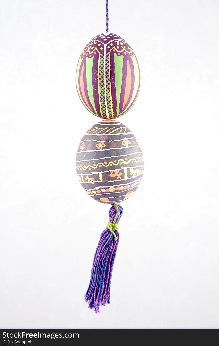 Handmade colored Easter eggs on the thread