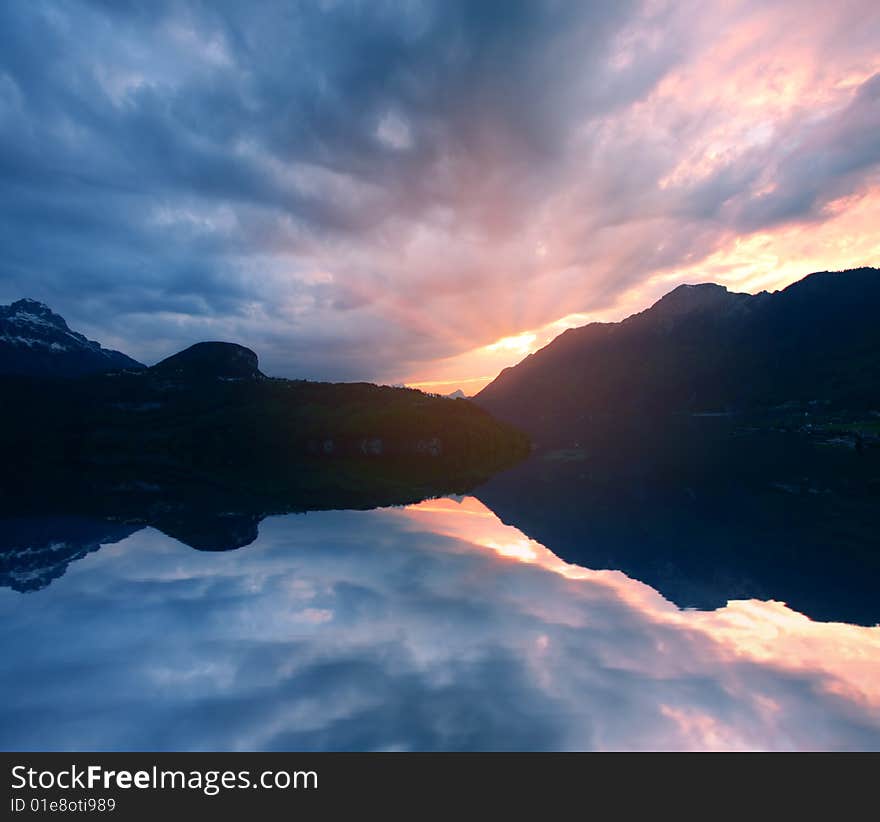 Evening sunset colorful lake and reflection. Evening sunset colorful lake and reflection