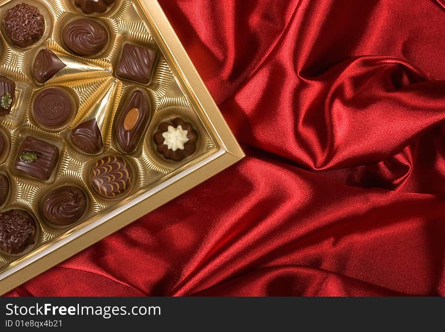 Chocolates Box On Red Satin