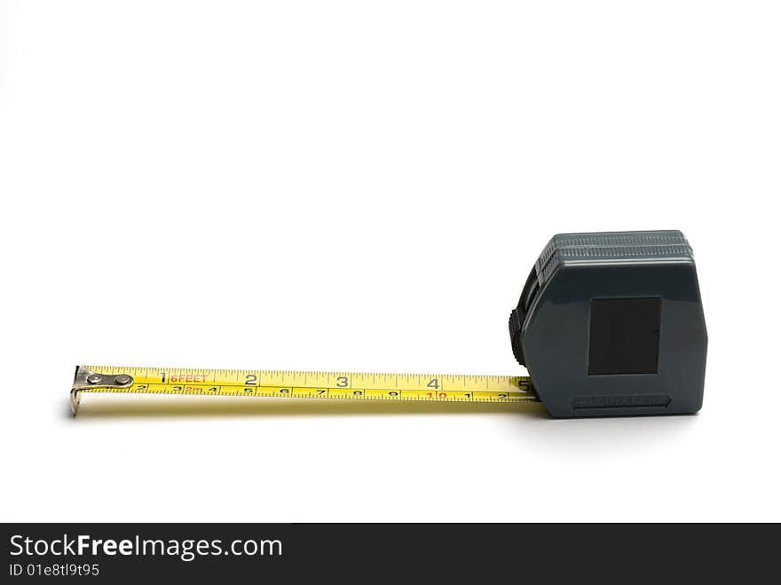 Tape measure with imperial and metric markings. Isolated on white