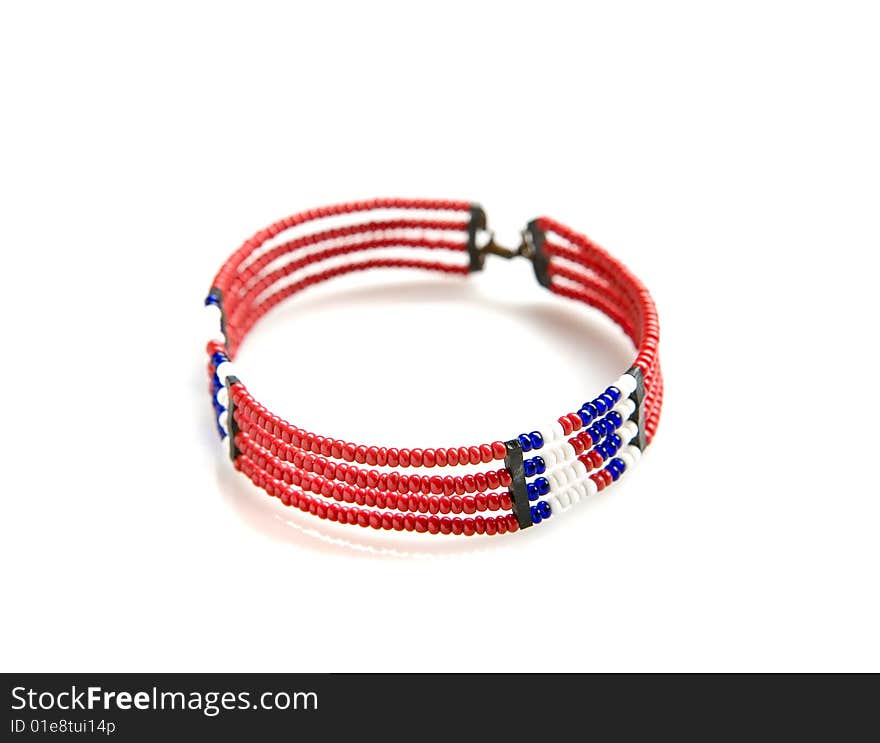 Red african bracelet on white ground