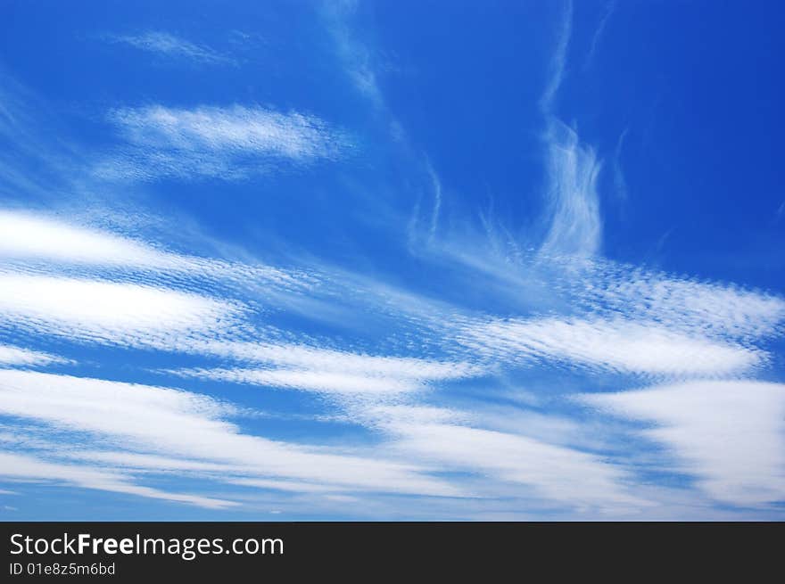 White clouds in a blue sky. Great background. White clouds in a blue sky. Great background