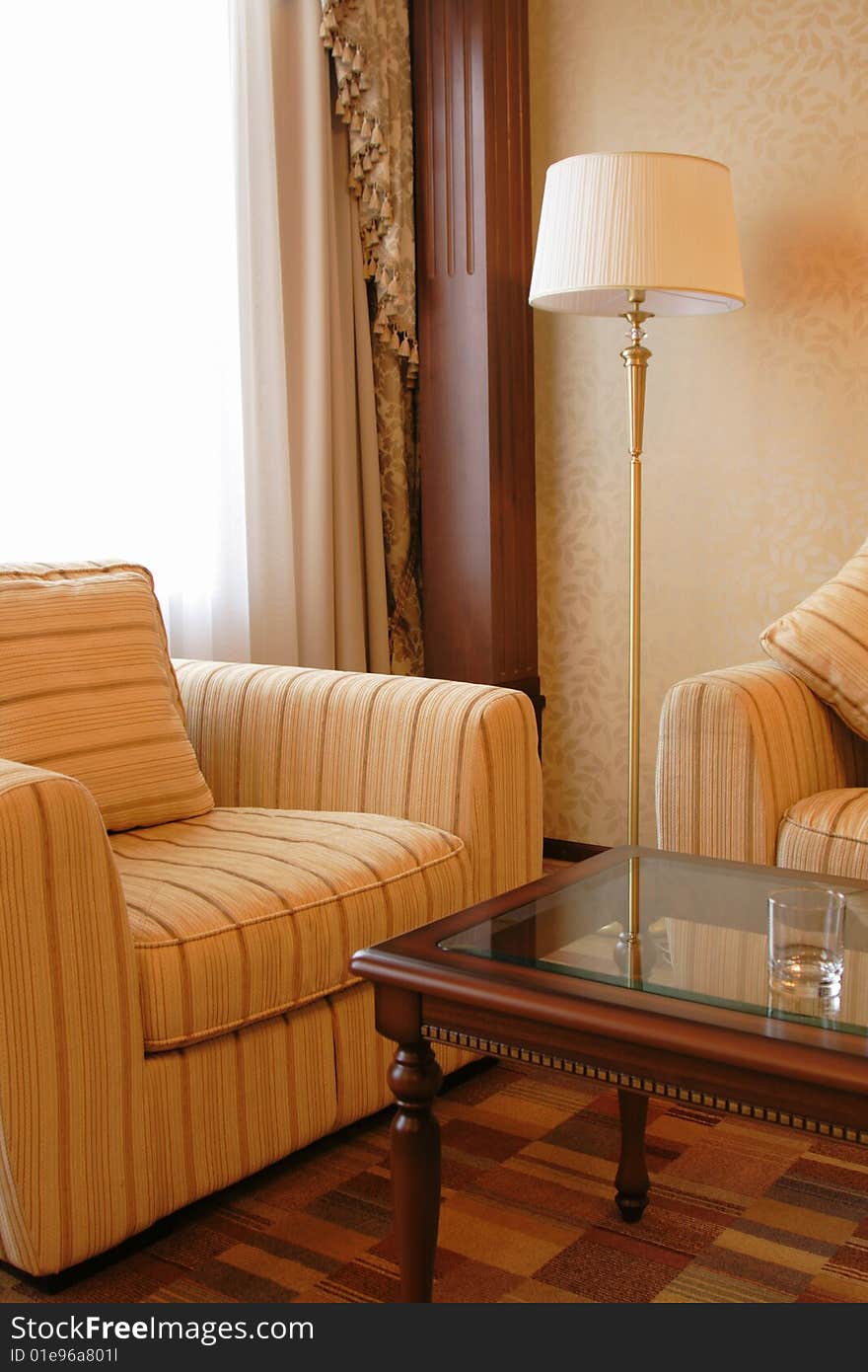 Floor lamp and armchair in a hotel suite