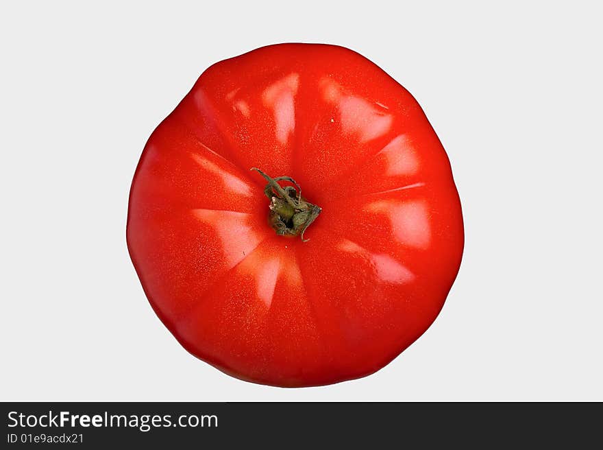 Vegetable tomato on a grey background