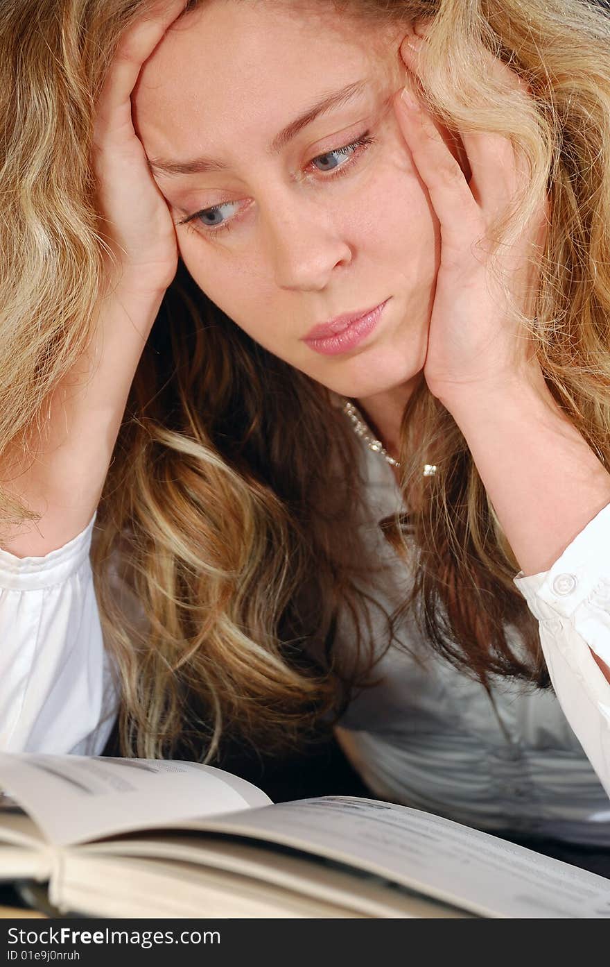 Young beautiful reading  concentrated girl. Young beautiful reading  concentrated girl