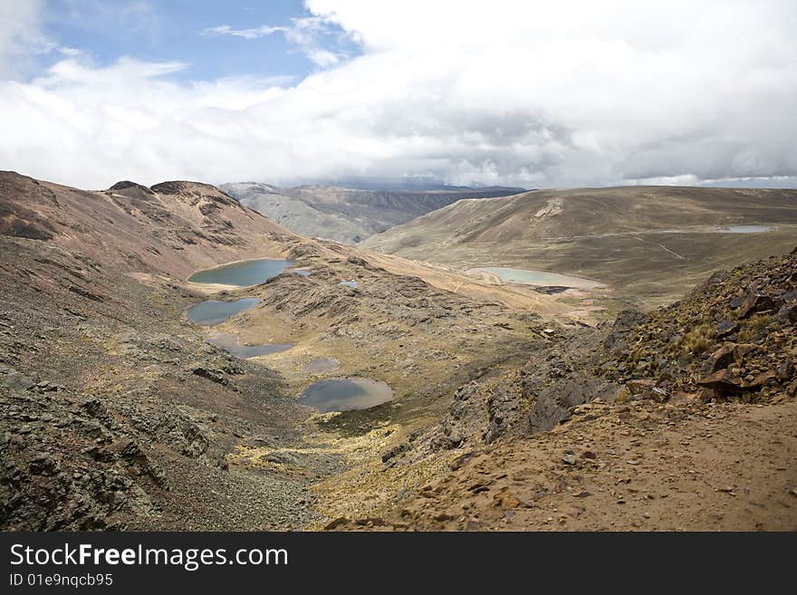 Chacaltaya is a glacierial mountain range in Bolivia with an elevation of 5421m and a view of Lake Titicaca in the distance. The glacier is about 30 km from La Paz, near Huayna Potos� mountain.