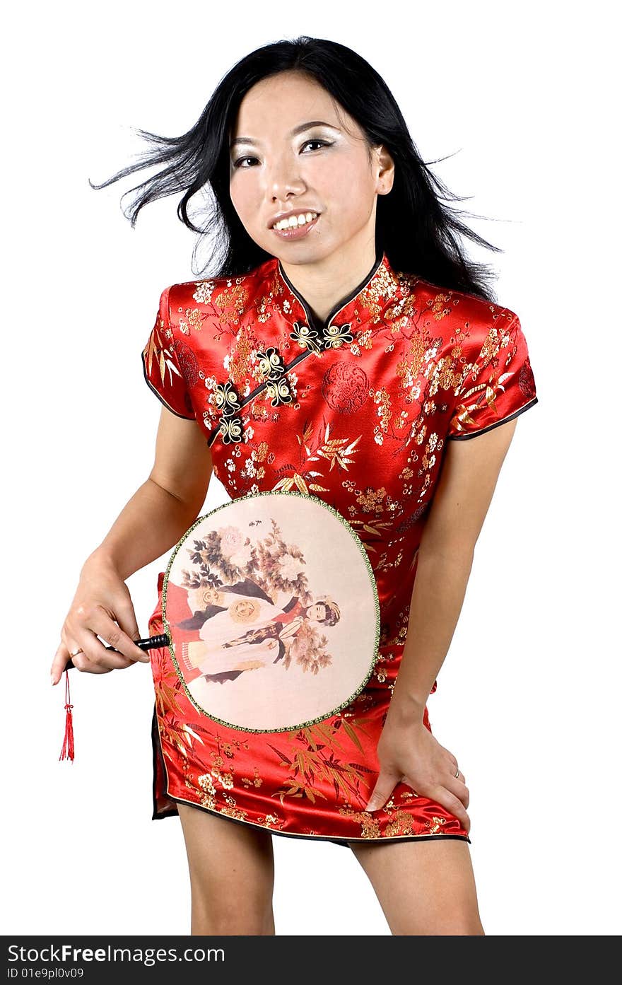 Chinese girl in traditional dress - QiPao, preparing for celebration of Chinese New Year in Shanghai, China. Chinese girl in traditional dress - QiPao, preparing for celebration of Chinese New Year in Shanghai, China.