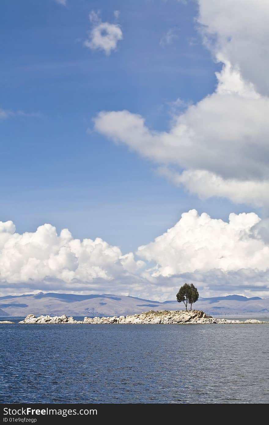 A single tree on and rocky island on Lake Titicaca. A single tree on and rocky island on Lake Titicaca.