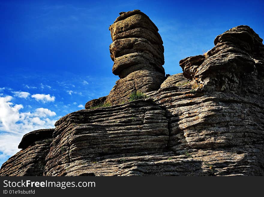 The blue sky under the natural weathering of rocks. The blue sky under the natural weathering of rocks