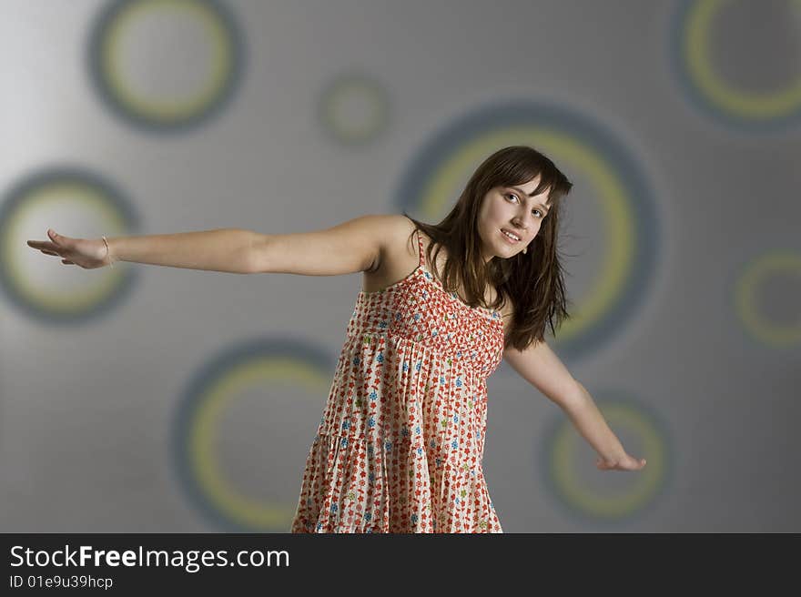 Teenager in dress on grey background. Teenager in dress on grey background