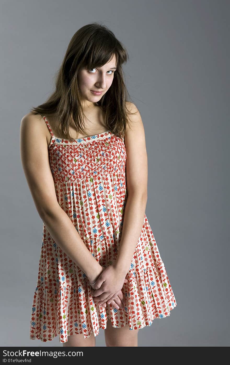 Teenager in dress on grey background. Teenager in dress on grey background