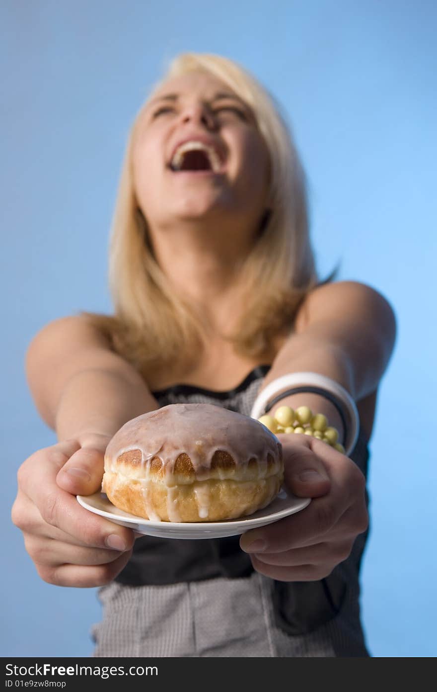 Teenager with the doughnut on the plate. Teenager with the doughnut on the plate