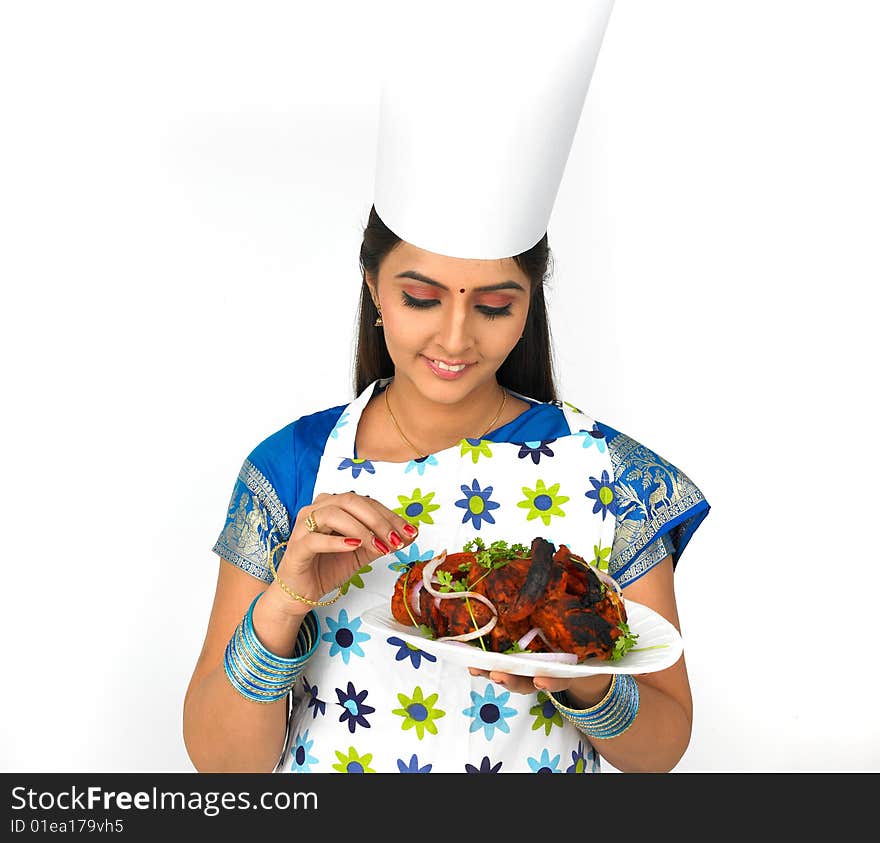 Female chef with her roasted chicken