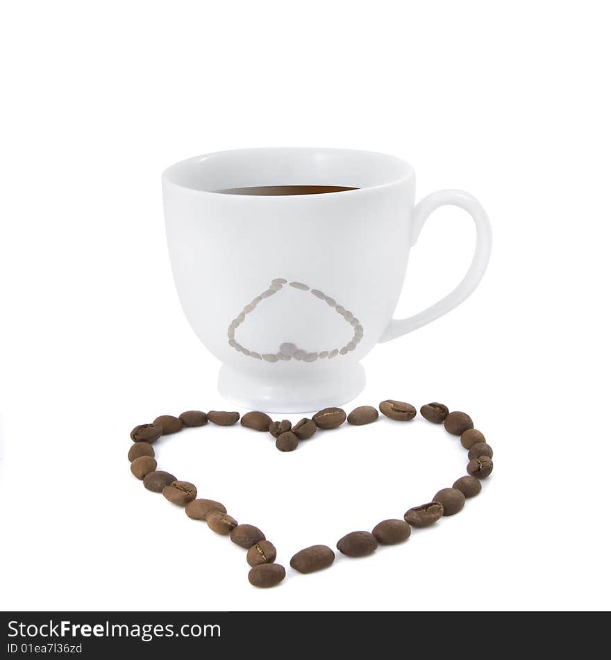 Coffee cup with heart from coffee beans