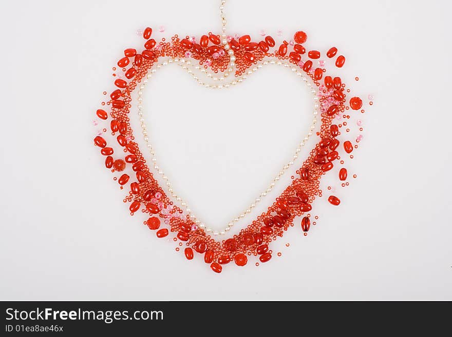 Red heart made with beads and pearls