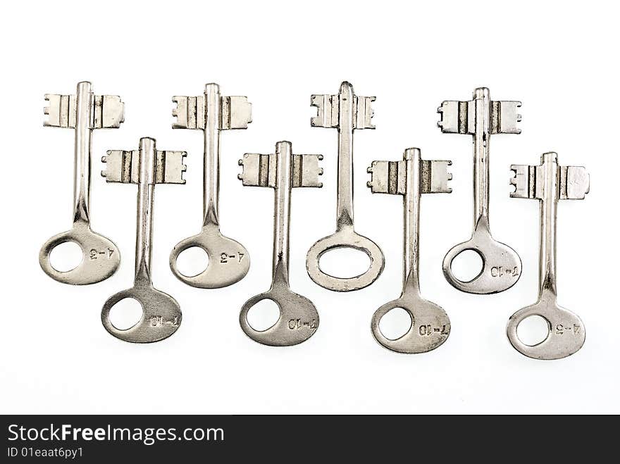 Set of old keys isolated on white background