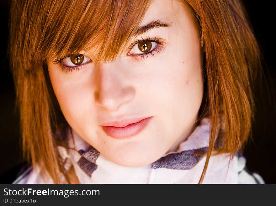 Young woman close portrait staring at camera. Young woman close portrait staring at camera.