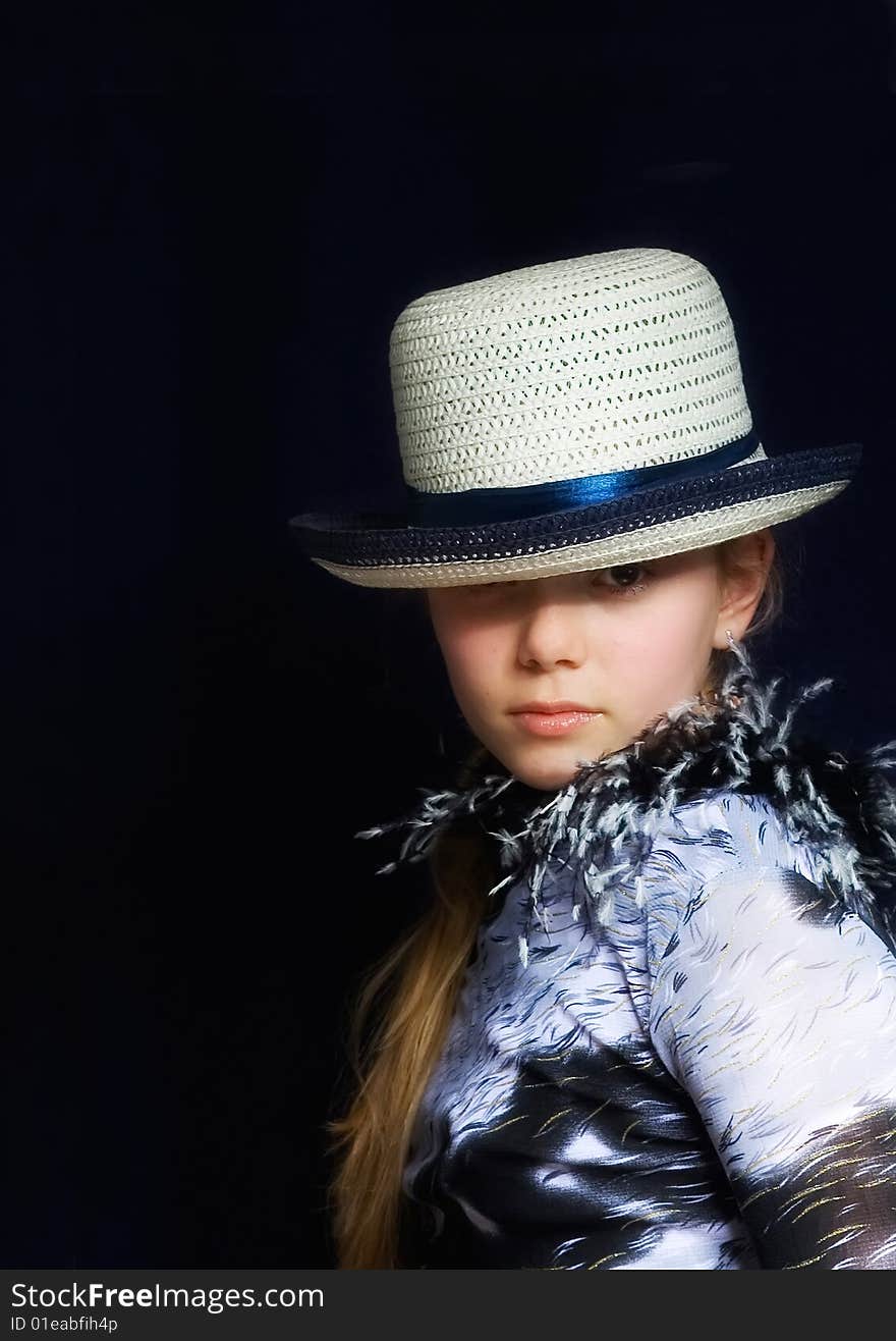 Girl in hat on black background. Girl in hat on black background