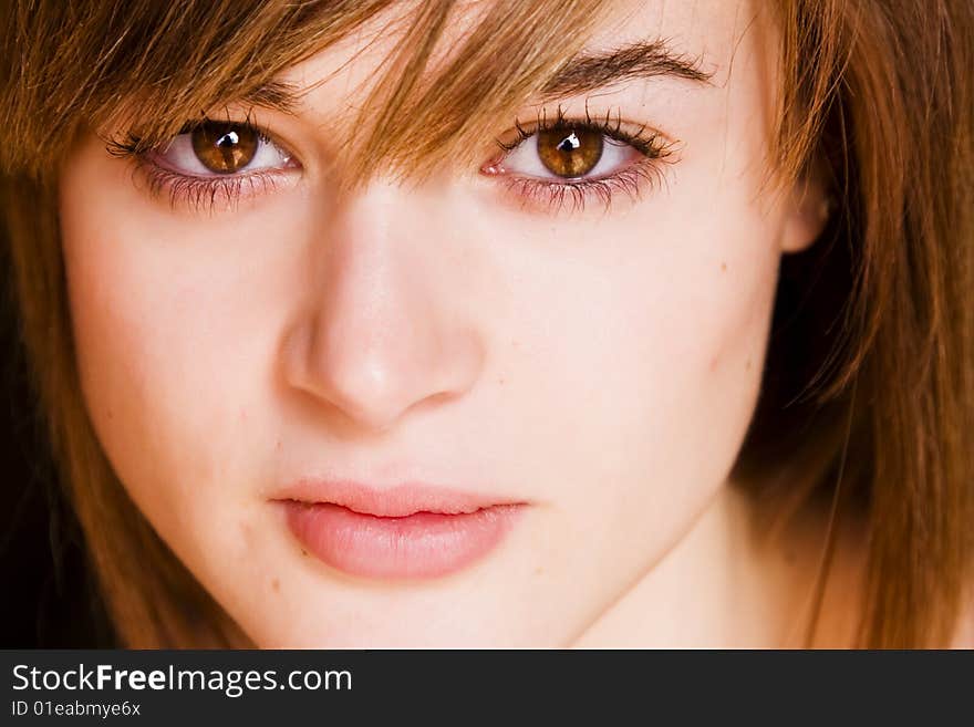 Young staring woman close portrait