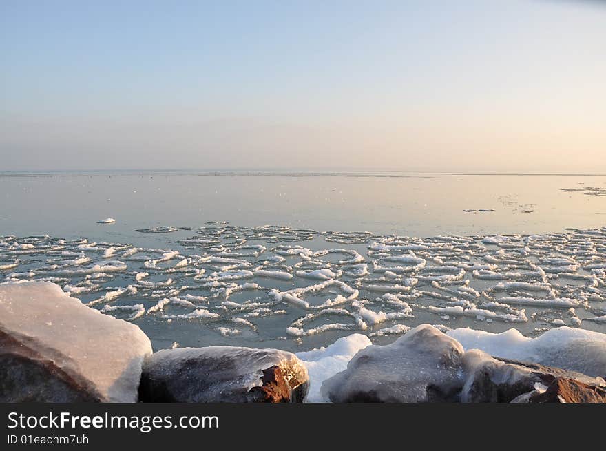 The ice of a lake is an icebound one under the blue sky in sunshine. The ice of a lake is an icebound one under the blue sky in sunshine.