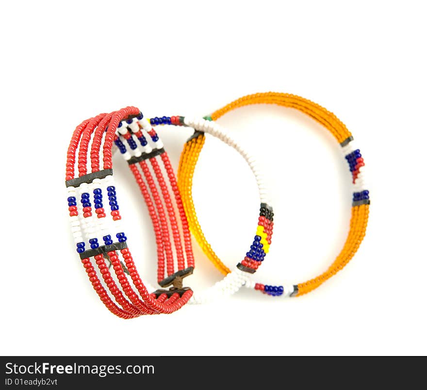 Three african bracelets on white ground