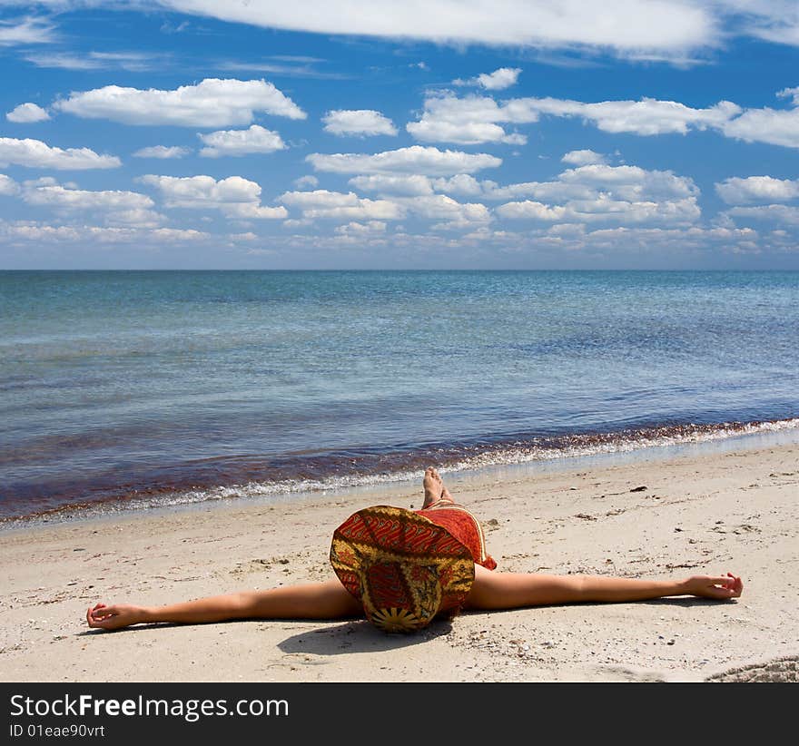 Girl in hat at seaside