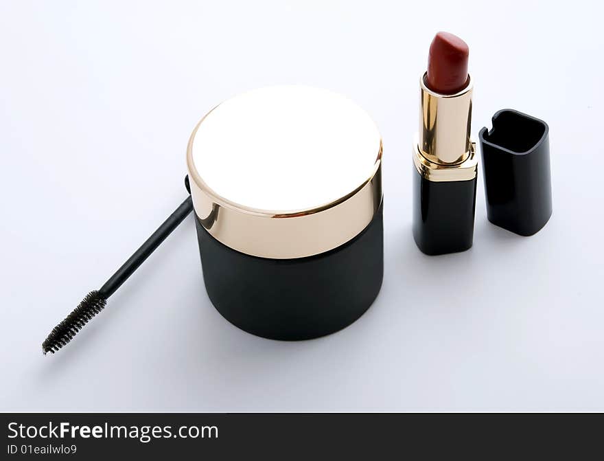 Black cosmetics collection on gray background