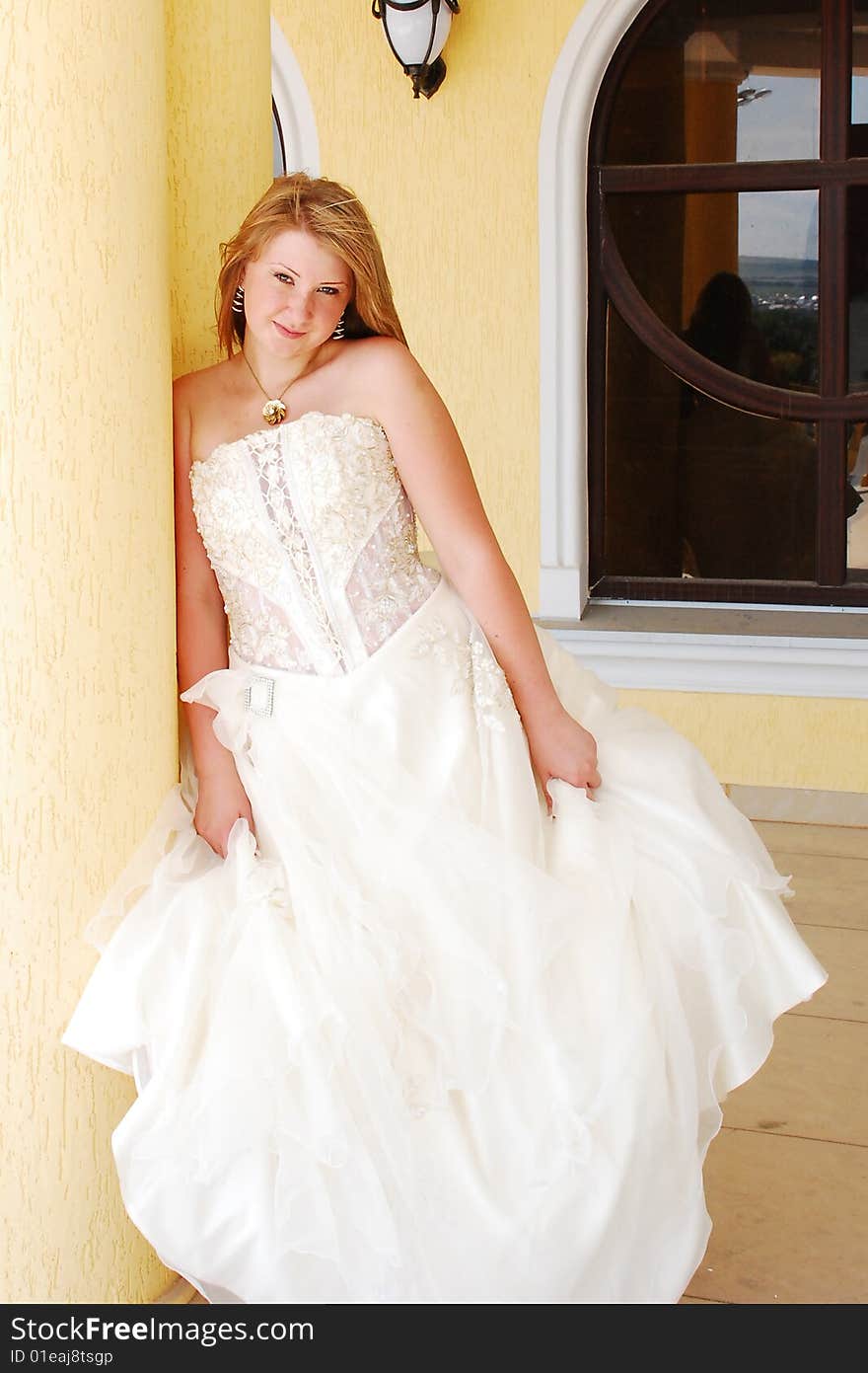 The happy girl in a wedding dress